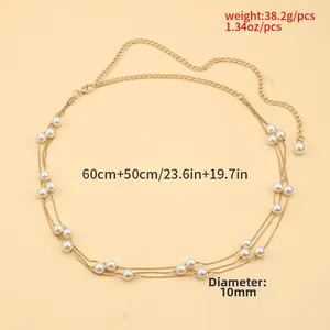 Detail of adjustable golden multi-layer body chain with 10mm faux pearls and lobster clasp