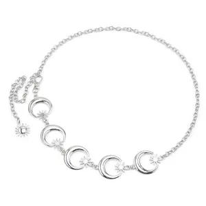 Close-up of silver celestial moon and star alloy waist chain with sun pendant charm