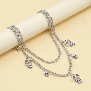 Double-layered punk metal waist chain with silver skull pendants in a gothic rock style