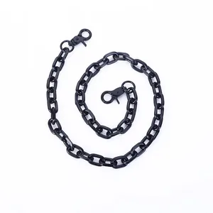 Black punk style metal waist chain with lobster clasps on a white background