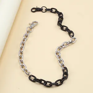Detail of industrial punk style chain with silver and black interlocking metal links