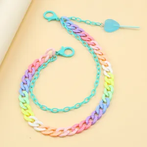 Close-up of candy-colored resin pants chain with a heart pendant and macaron link loops