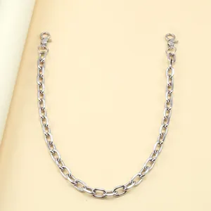Close-up of shiny silver metal chain with lobster clasps for bags or clothes