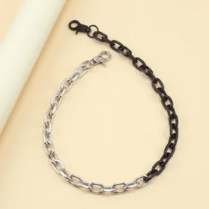 Detail of creative two-tone silver and black chain link with secure lobster clasp