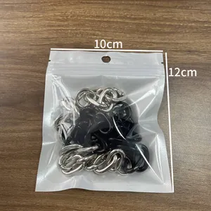 Close-up of black and silver link chain accessories in a 10x12cm transparent bag