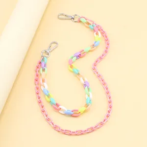 Close-up of colorful double-layered acrylic pant chains with silver lobster clasps