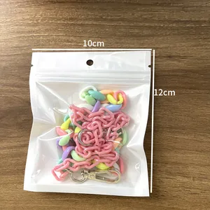 Detail of colorful acrylic pant chains with metal clasps inside a 10x12cm storage bag