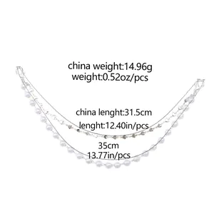 Detailed view of triple-layered silver bag chain with hearts and pearls including dimensions