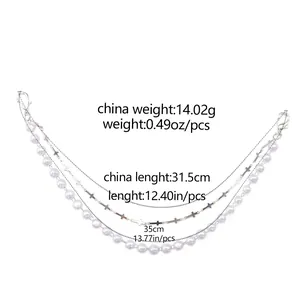 Three-layer bag chain with metal links, silver crosses, and pearls with lobster clasps