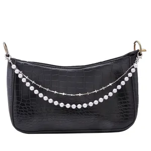 Black crocodile pattern shoulder bag with pearl accents and silver cross chain detail