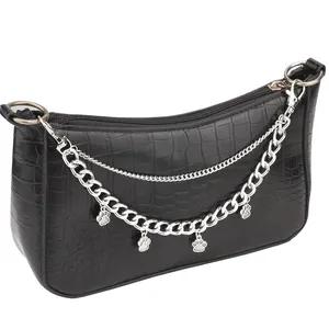 Black crocodile embossed baguette bag featuring layered silver chains and cat paw charms