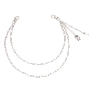 Double-layered hip hop pants chain with silver skull and key charms on white background