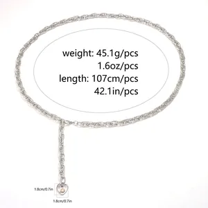 Detail of silver metal chain belt with heart pendant and pearl inlay showing size specs