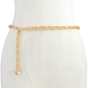 Fashionable gold metal waist chain with elegant pearl heart pendant on white mannequin