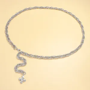 Detail of silver metal chain belt with sparkling rhinestone clover pendant for dresses
