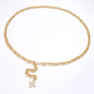 Close-up of golden metal waist chain featuring adjustable lobster clasp and floral pendant