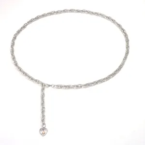 Close-up of silver metal waist chain featuring a heart-shaped pendant with a white pearl
