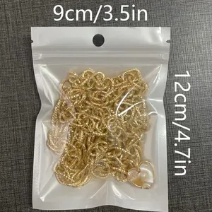 Detail of heart pendant metal waist chain in clear packaging showing 9x12cm size