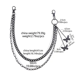 Détail de la chaîne de pantalon noire double couche avec pendentif papillon et tailles