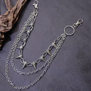 Close-up of triple-layered silver metal pant chain with punk studs and lobster clasps