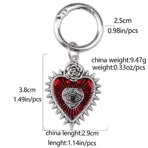 Gothic red heart shoe charm with silver devil eye and rose detail on white background