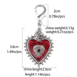 Detailed view of Gothic devil eye heart charm with dimensions and rose detail