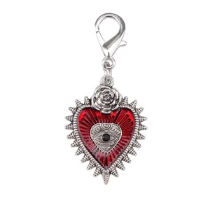 Gothic silver heart charm with red evil eye and rose detail on lobster clasp
