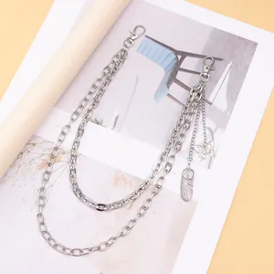Silver layered pants chain with butterfly and feather charms in punk Y2K street style