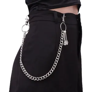 Detail of silver punk hip-hop pants chain featuring skull charms and lobster clasps