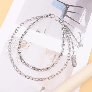 Double-layered silver pant chain featuring feather and butterfly charms with lobster clasps