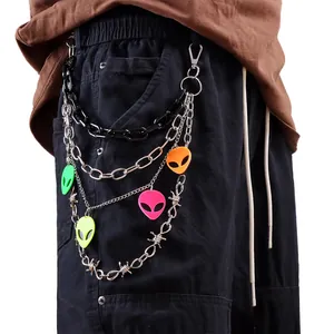 Detail of multi-layer street style belt chain with neon aliens and barbed wire texture