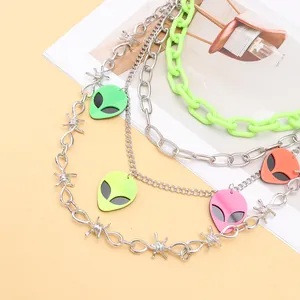 Close-up of Y2K waist chain featuring colorful alien pendants and neon green plastic links