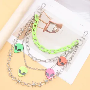 Neon green layered waist chain with alien pendants and silver metallic barbed wire links