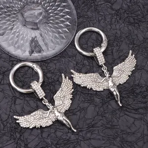 Detail of silver angel wing charms with white rhinestones and round spring rings