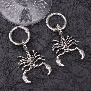 Detail shot of vintage silver scorpion pendants with spring rings for punk boots