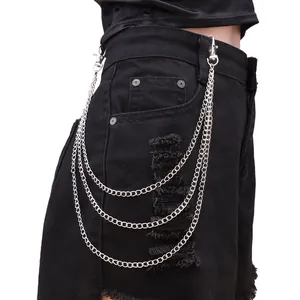 Three-layer silver metal pants chain with lobster clasps on black distressed denim shorts