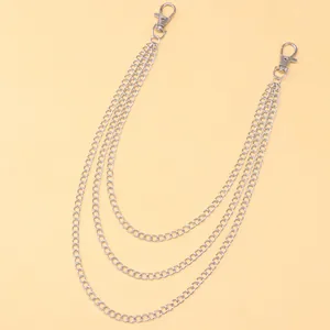 Detailed close-up of a three-layer silver metal pants chain with sturdy lobster clasps