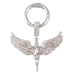 Detailed close-up of a silver goddess wing pendant with micro-paved rhinestones