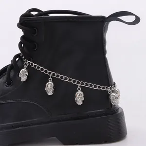 Punk silver shoe chain with skull pendants on black martin boots, gothic metal jewelry style