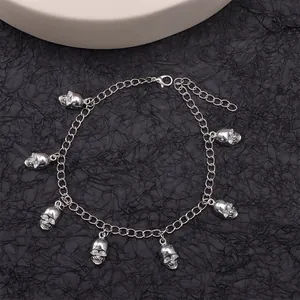 Punk silver metal chain accessory with seven detailed skull pendants and lobster clasp