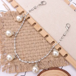Elegant silver shoe chain with sparkling rhinestones and large white pearls for boots
