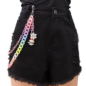 Detail of candy-colored acrylic trouser chain with snowman and snowflake charms