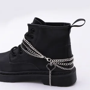 Black platform boots featuring triple layered silver chains and pixel heart charm detail