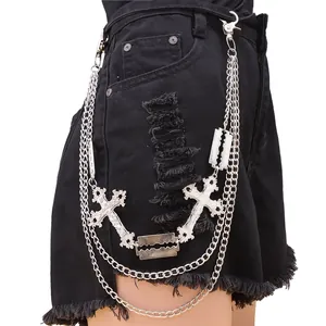 Detail of triple-layered metal pants chain with hollow crosses and faux blade pendants
