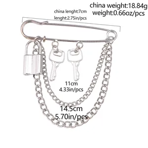Detail view of silver lock and key brooch pin with chains and exact dimensions