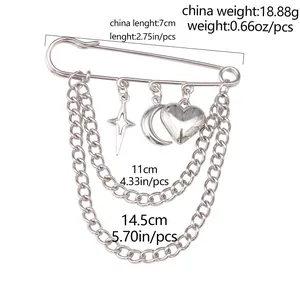 Detailed specs of silver layered pin brooch with star, moon, and heart charms
