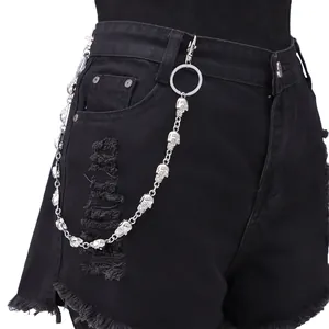 Silver skull metal pants chain with lobster clasps and rings on black denim shorts