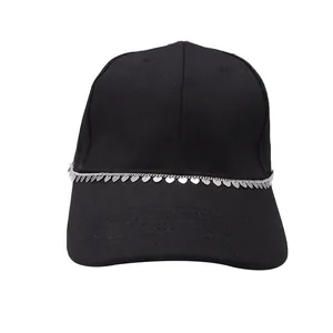 Detail of black cotton baseball cap featuring silver chain with small heart pendants