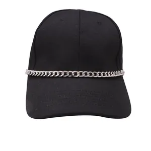 Close-up of black cotton baseball cap with silver metal chain detail in punk style