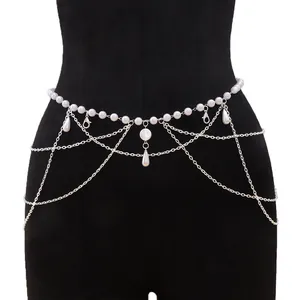 Elegant multi-layer pearl waist chain with silver tassel fringe on a black mannequin